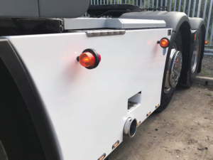 Danish side lamp with Gylle lens ORANGE - mounted with mounting base on side skirt Scania - EAN: 7392847307866